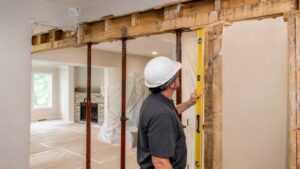 Partially opened interior wall with temporary supports during structural evaluation