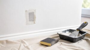 Small drywall mesh patch with compound pan and sanding sponge