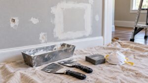 Editorial home improvement scene for Common Drywall Problems—And How to Fix Them Quickly